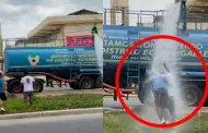 [Video] Piuranos no soportan el calor y se baan con agua de camin cisterna