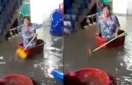 Mujer utiliza balde y escoba para navegar en su vivienda inundada: "Al mismo estilo de Titanic"