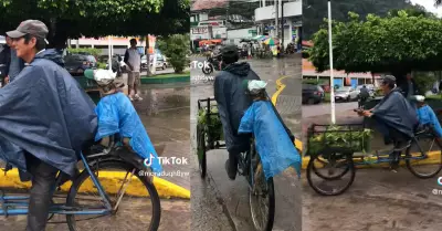 Un hombre y su mascota son vistos transitando por una avenida en un triciclo.