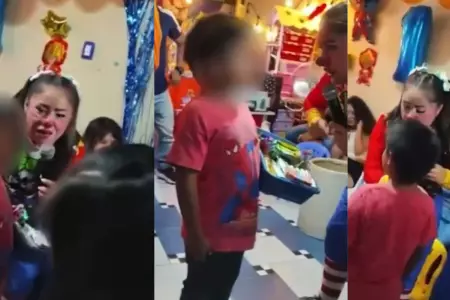 Payasita ayuda a vender golosinas a un nio en una fiesta infantil