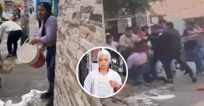 Propietarios de funeraria arrojan agua con leja a vendedora de desayunos.