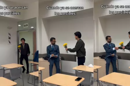 Universitario entrega flores amarillas a su profesor.