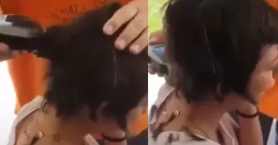 Padre rapa la cabeza de su hija como forma de castigo.