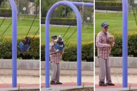 Abuelito columpia a sus tres perritos en un parque.