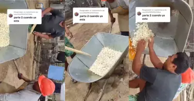Obreros cocinan canchita pop corn en carretilla.