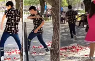 Con el corazn destrozado! Joven rompe ramo de rosas tras ser rechazado por una porrista