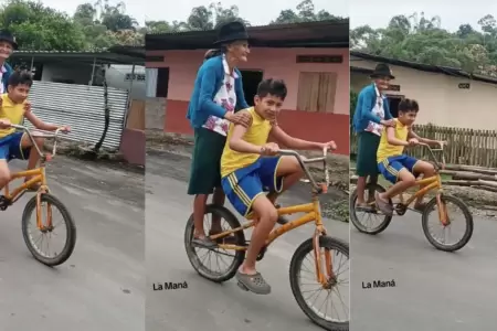 Niño lleva a su bisabuela en bicicleta.