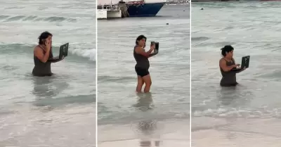 Mujer trabaja en medio del mar durante sus vacaciones.