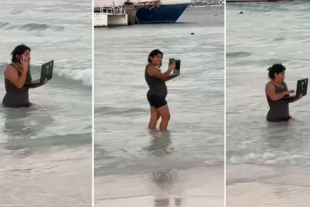 Mujer trabaja en medio del mar durante sus vacaciones.