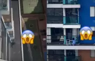 Inslito! Mujer arriesga su vida al limpiar ventanas en piso 23 sin proteccin: "No le teme a nada"