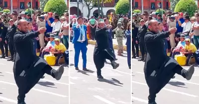 Sacerdote participa de desfile por fiestas patrias.