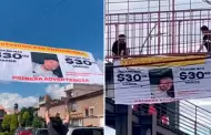 Joven coloca cartel gigante en un puente para que su amigo le pague: "Vividor sinvergenza"