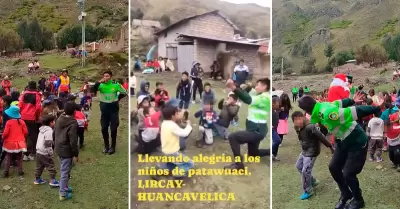 Polica baila huaylas con nios en chocolatada navidea.