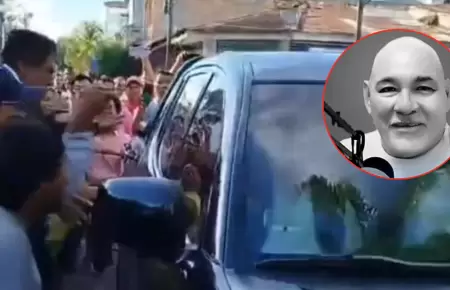 Ciudadanos intentan agredir vehículo de MP por muerte de Raúl Celis.