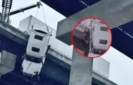 Accidente en carretera deja a chofer de tráiler colgado a más de 30 metros de puente: Tuvo dramático rescate