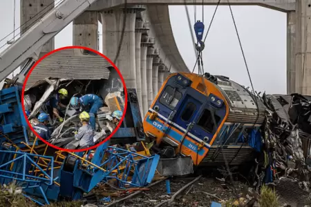 Gr�a cae sobre tren dejando al menos 29 muertos y decenas de heridos