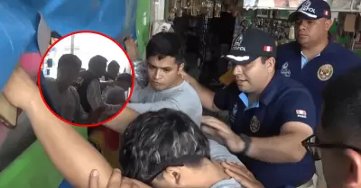 Polic�a en retiro y su hermano son capturados por asesinato a cambista