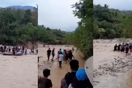 Trasladan ata�d en flotador por el r�o debido a falta de puente
